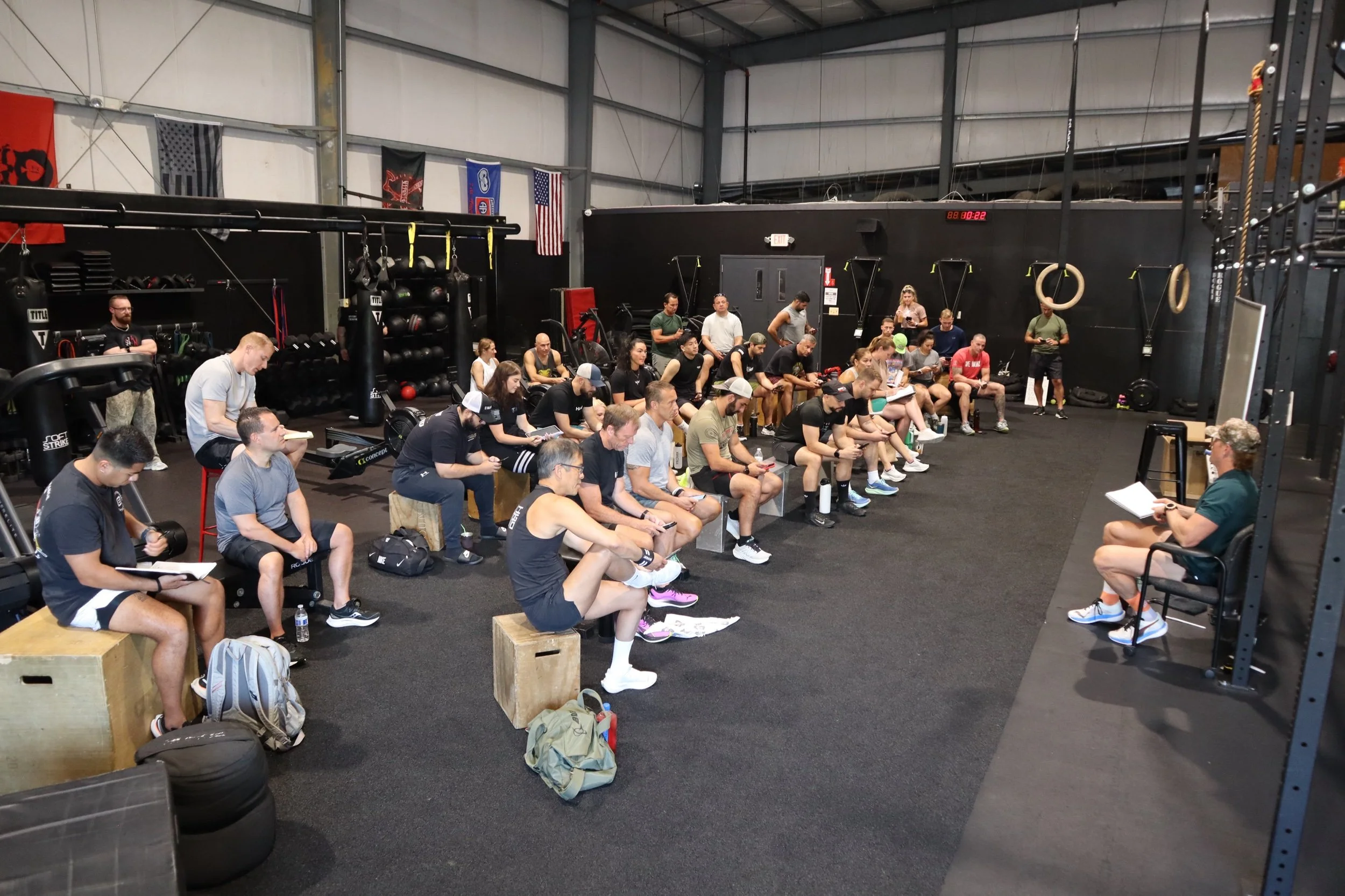 ARCH athletes at a coach-led HYROX training briefing
